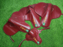 Maroon custom name racing saddle with glossy leather finish