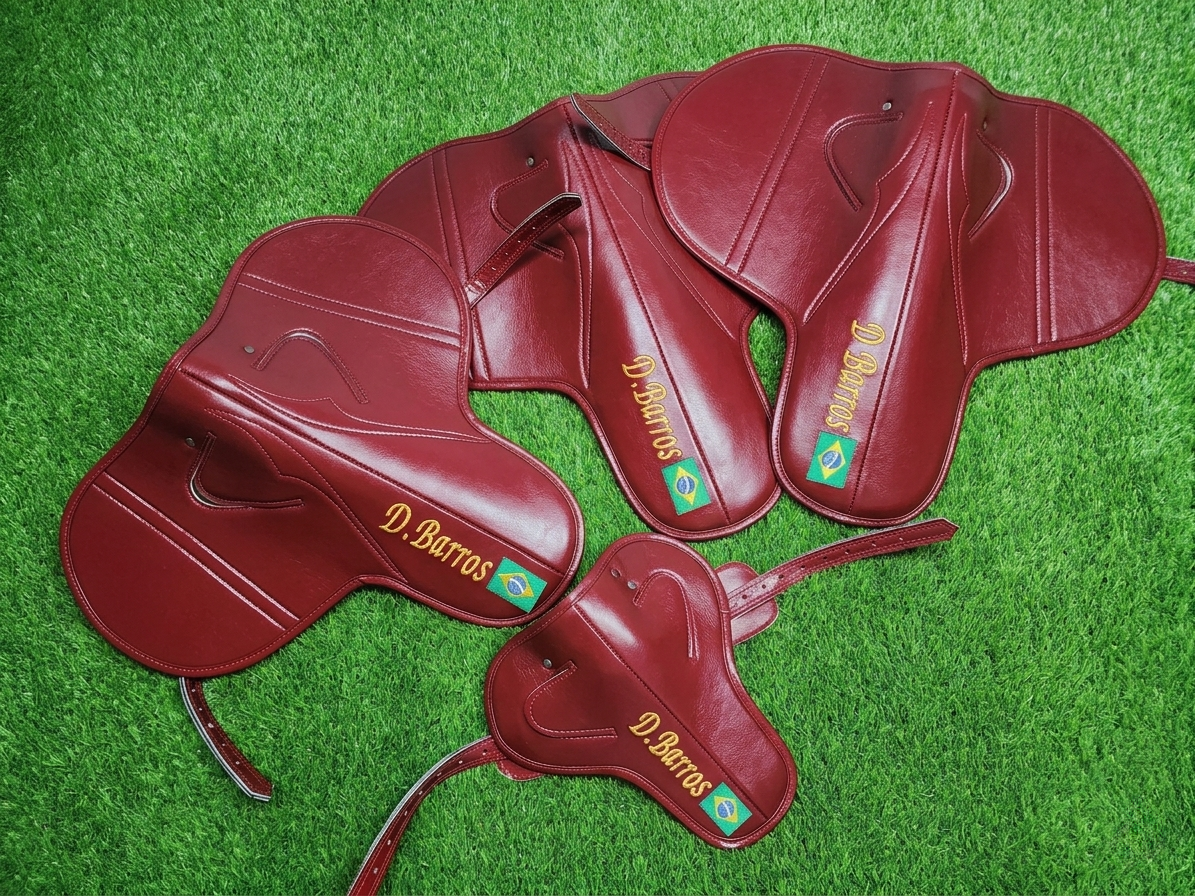 Maroon custom name racing saddle with glossy leather finish